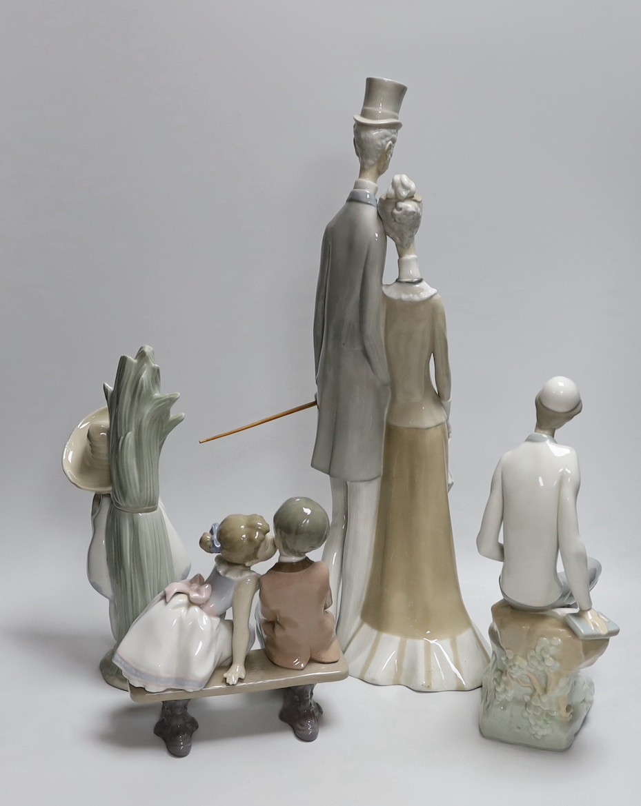 A group of four Lladro figures. Tallest 50cm